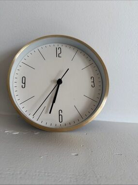 Gold Rim Wall Clock with White Face and Black Hands